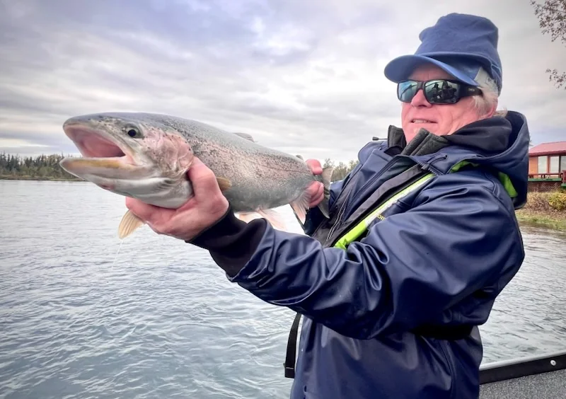Angler with a rainbow trout on the Kenai River, Cooper Landing, Alaska